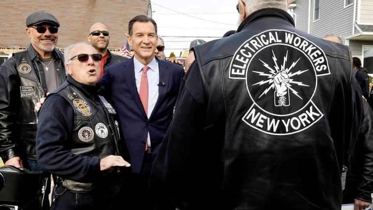 Former Rep. Tom Suozzi talks with supporters Saturday in Levittown. He held the 3rd Congressional District seat from 2017 through 2022. Credit: Debbie Egan-Chin