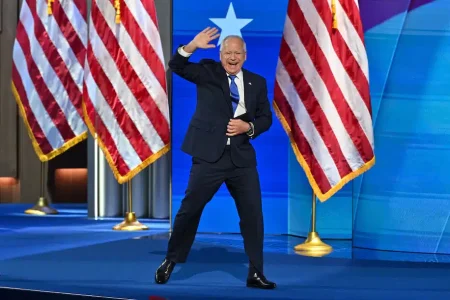 Minnesota Gov. Tim Walz taking the stage Wednesday in Chicago to accept the Democratic nomination for vice president. (Ricky Carioti/The Washington Post)